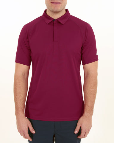 Man wearing maroon Adidas recycled bermuda polo