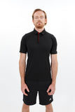 Man wearing Adidas recycled bermuda polo with adidas shorts