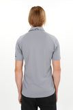 Man wearing grey Adidas recycled bermuda polo with adidas shorts