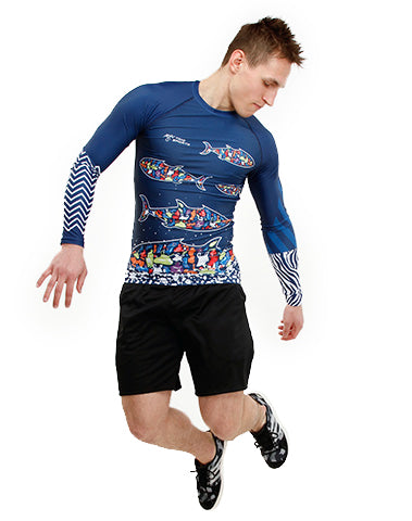 Fit Man jumping wearing Plastique Trashee Rashguard made from Recycled Ocean Waste