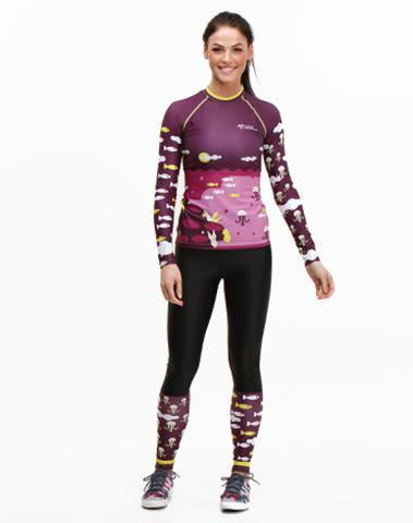 Woman wearing Trashee collection Rashguard and Leggings made from Recycled Ocean Waste
