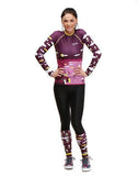 Smiling woman wearing Trashee collection Rashguard and Leggings made from Recycled Ocean Waste